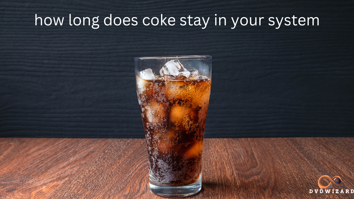 A glass of cola with ice on a wooden table, illustrating the concept of how long does coke stay in your system.