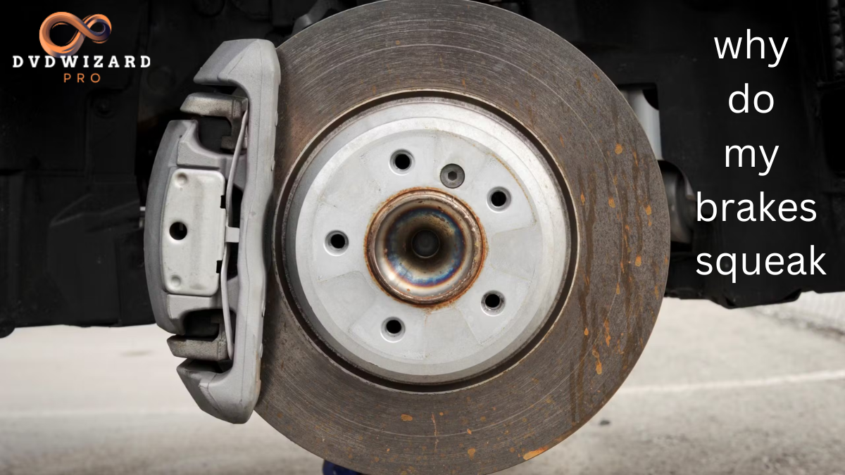 Close-up of a car brake rotor and caliper with rust marks, illustrating the question 'why do my brakes squeak' as the brakes show signs of wear.