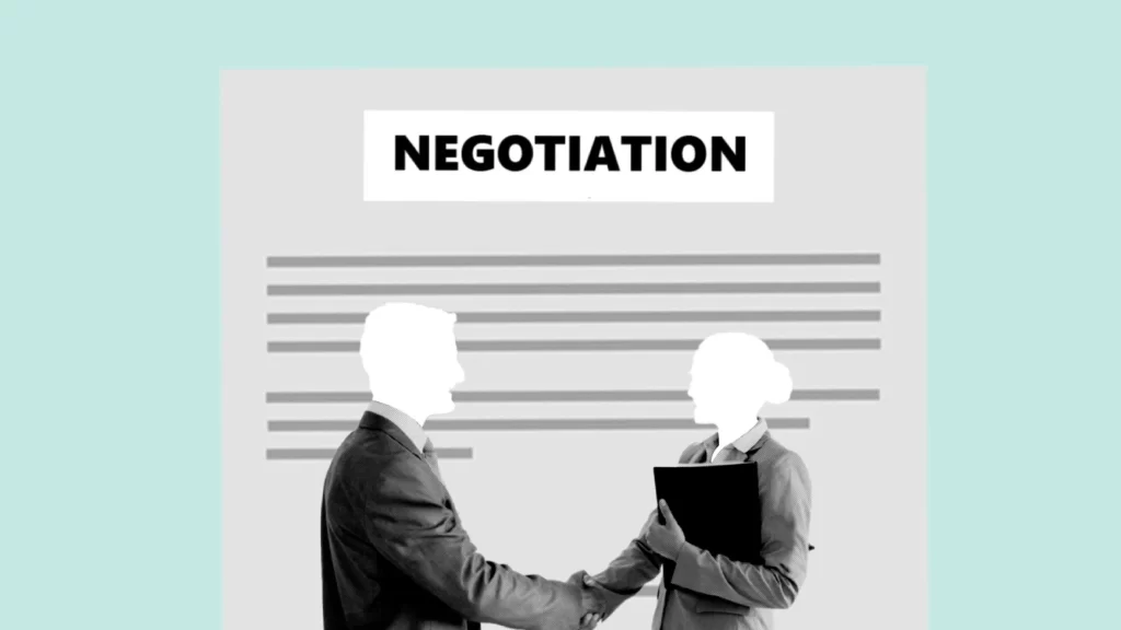 Two business professionals shaking hands in front of a negotiation document backdrop.